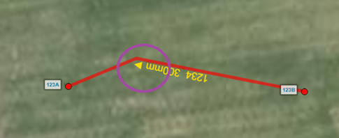 After using the Flip Pipe tool, the map displays a highlighted pipe with its flow direction reversed, indicated by an arrow pointing in the opposite direction. The surrounding map environment shows pits and other pipes in muted colors. The interface is neutral and functional, focusing on utility mapping. No visible text in the image.